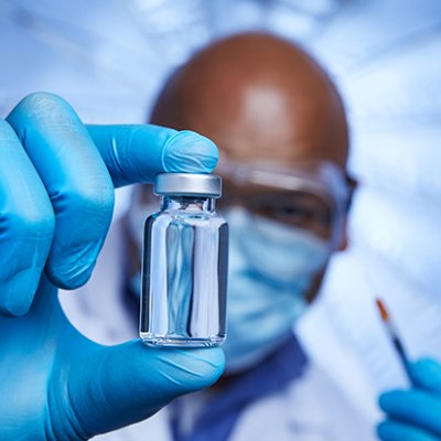 Man holding a vial